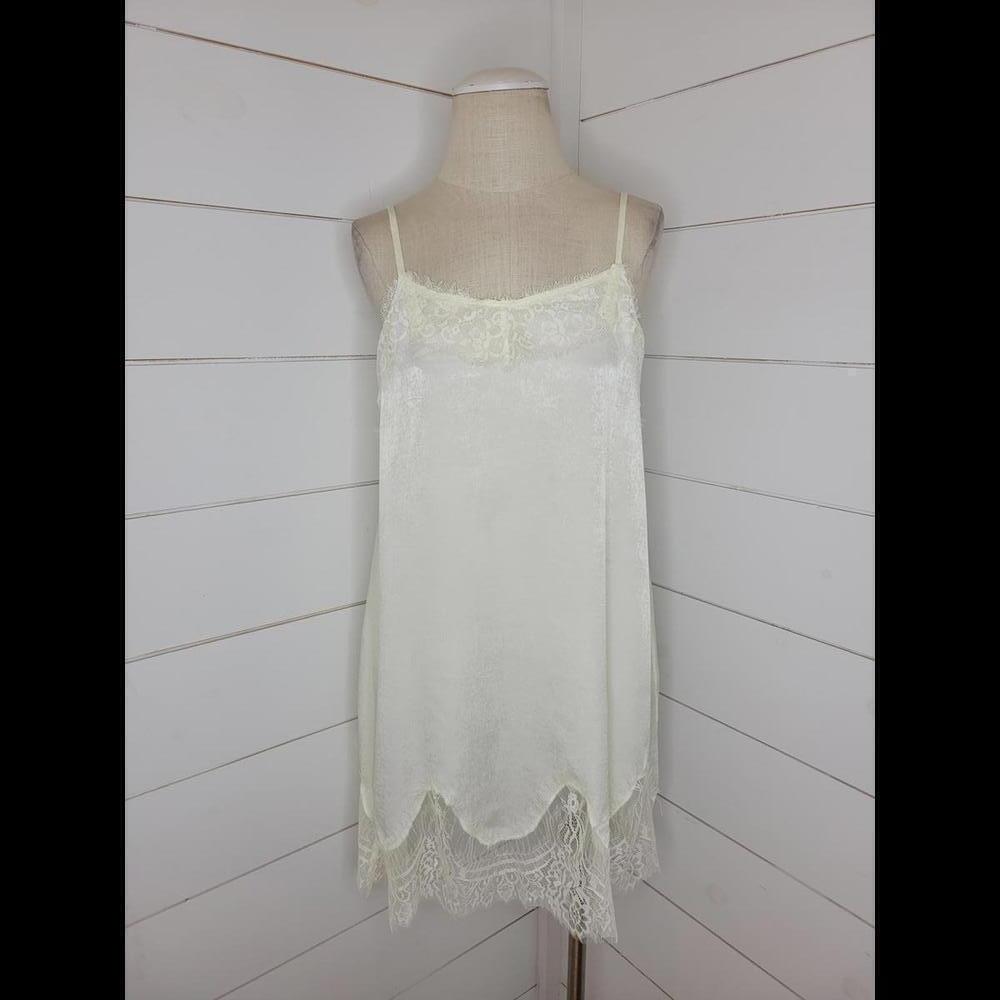 NWT Boutique Oddy cream mini slip with lace accents